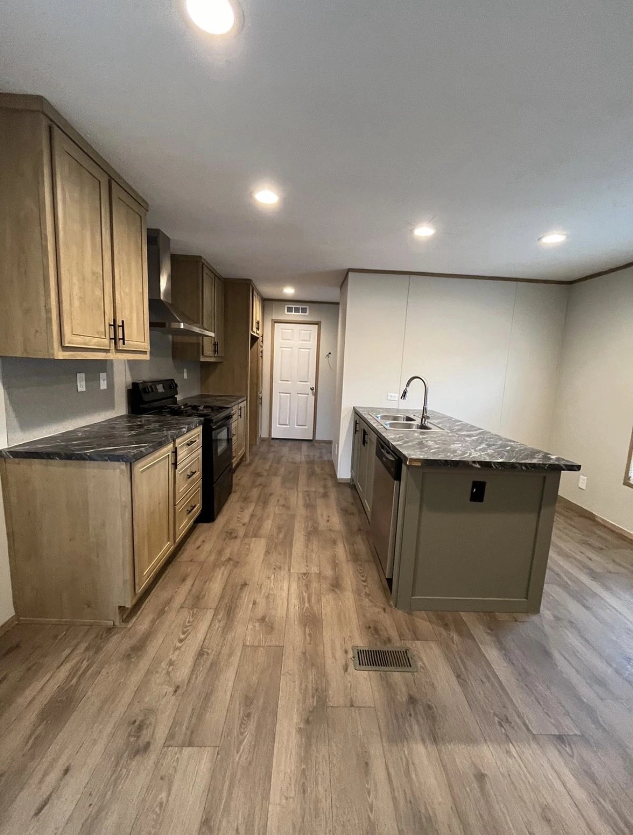 Updated kitchen with wood-tone cabinets